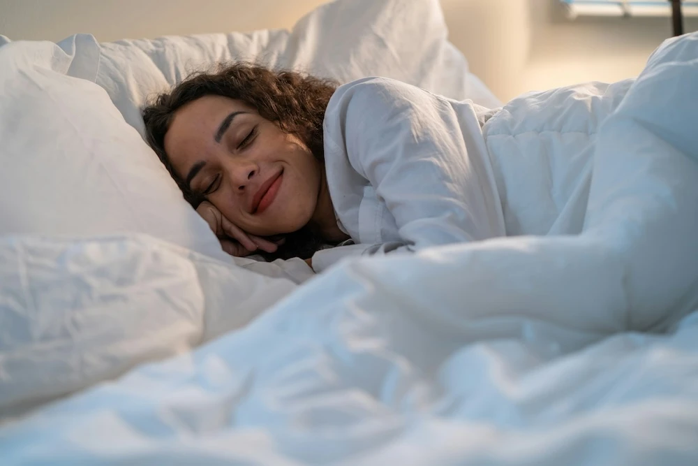 woman happily sleeping